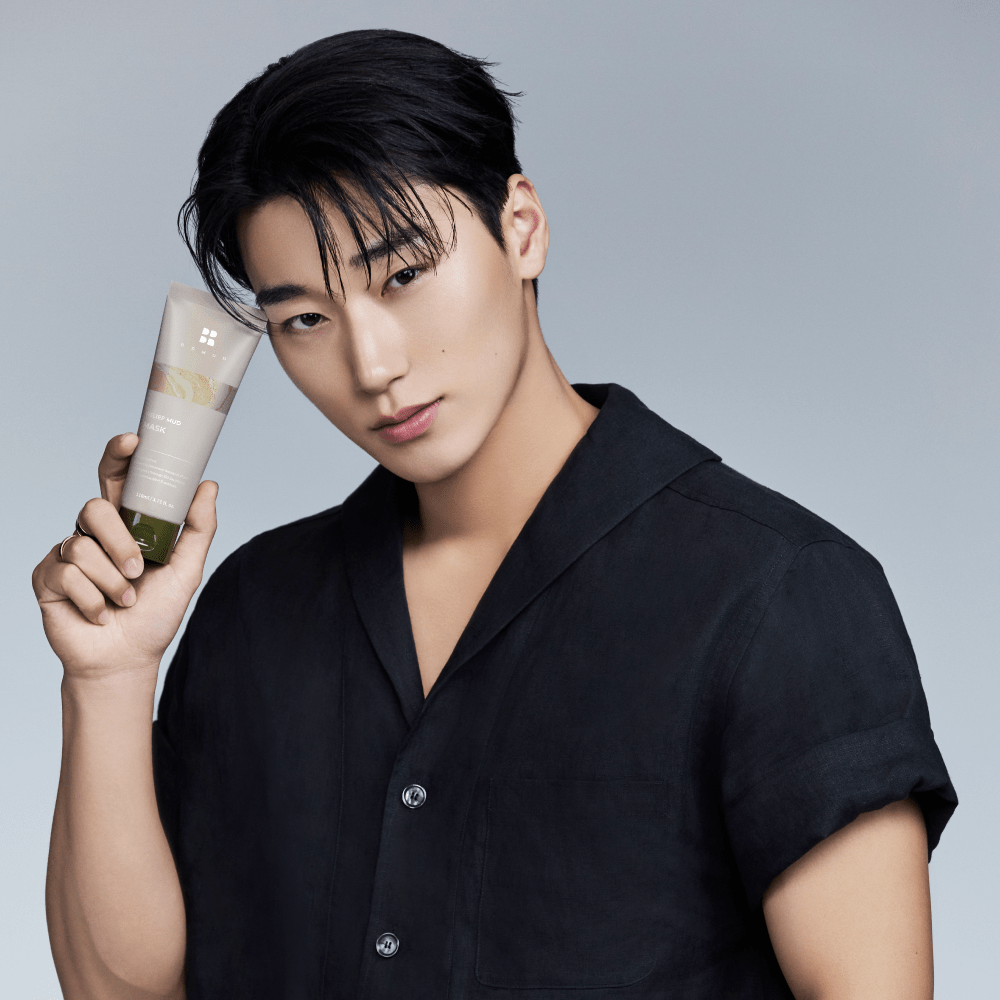 ATEEZ member holding BRMUD Relief Mud Mask for Korean skincare campaign